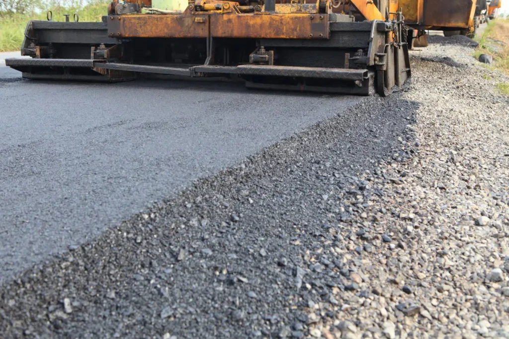 closeup of an asphalt paving machine