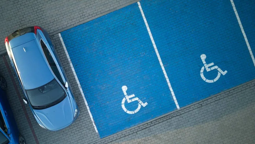 aerial view of two blue handicapped spaces
