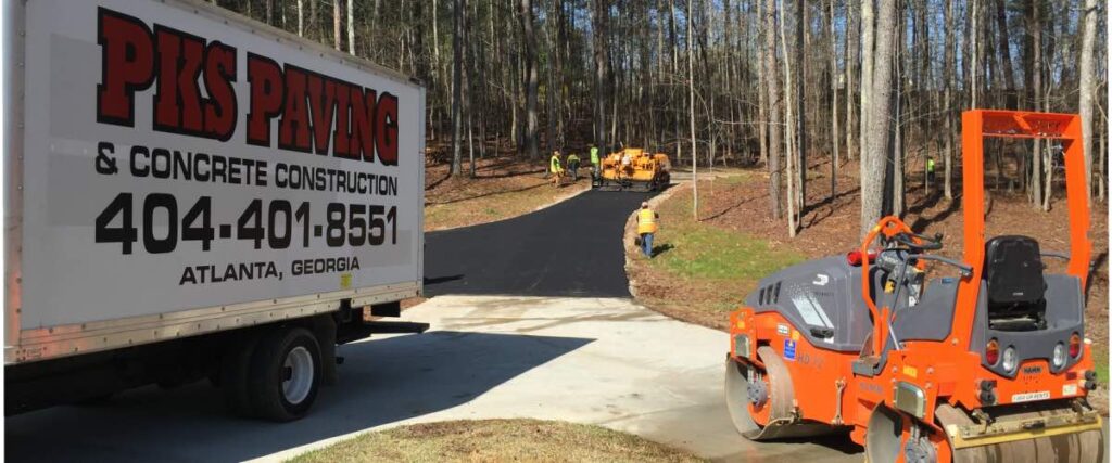 pks paving truck in front of a driveway