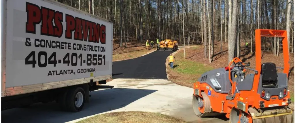 pks paving truck in front of a driveway