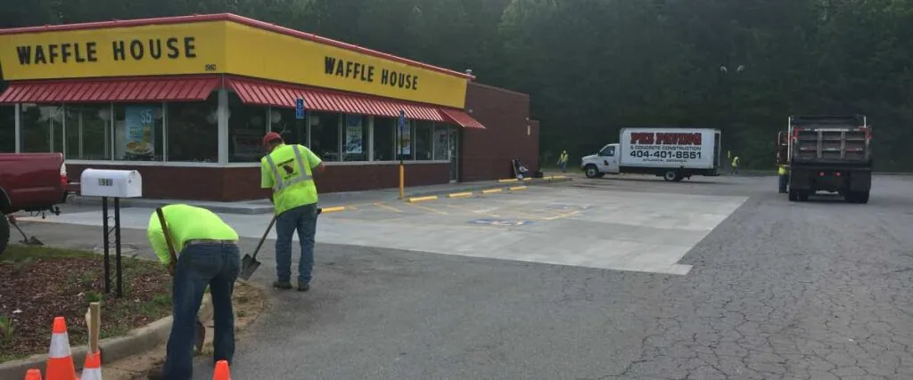 pks paving employees working at a waffle house parking lot
