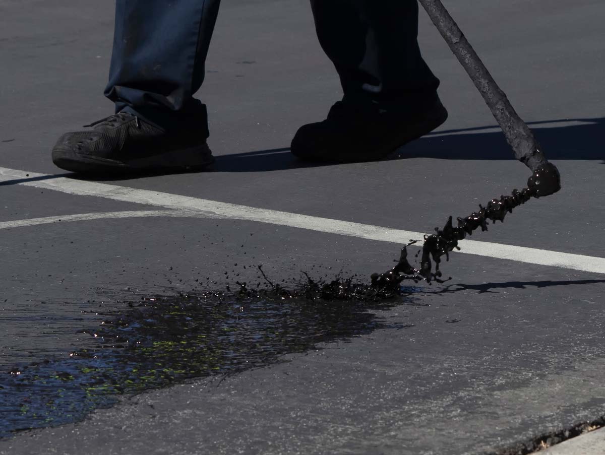 Read more about the article Asphalt Sealcoating: The Complete Guide to Protecting Your Pavement