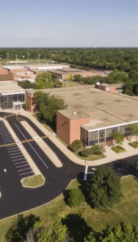 Educational-Facilities-2.png aerial view of a school and parking lot