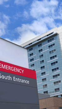 Healthcare.png emergency sign in front of a hospital