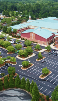 Non-Profits.png aerial view of a church and parking lot