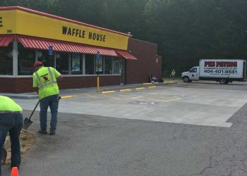 pks paving employees working in a waffle house parking lot