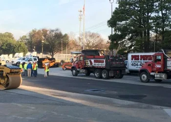 a group of pks paving trucks